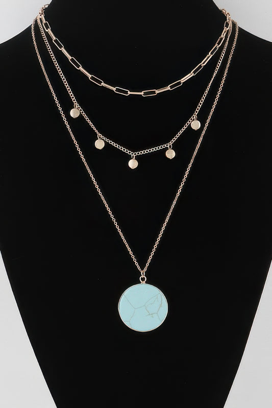 Golden Heir multi-stone pendant chain necklace with gold and turquoise stones, elegant jewelry accessory.
