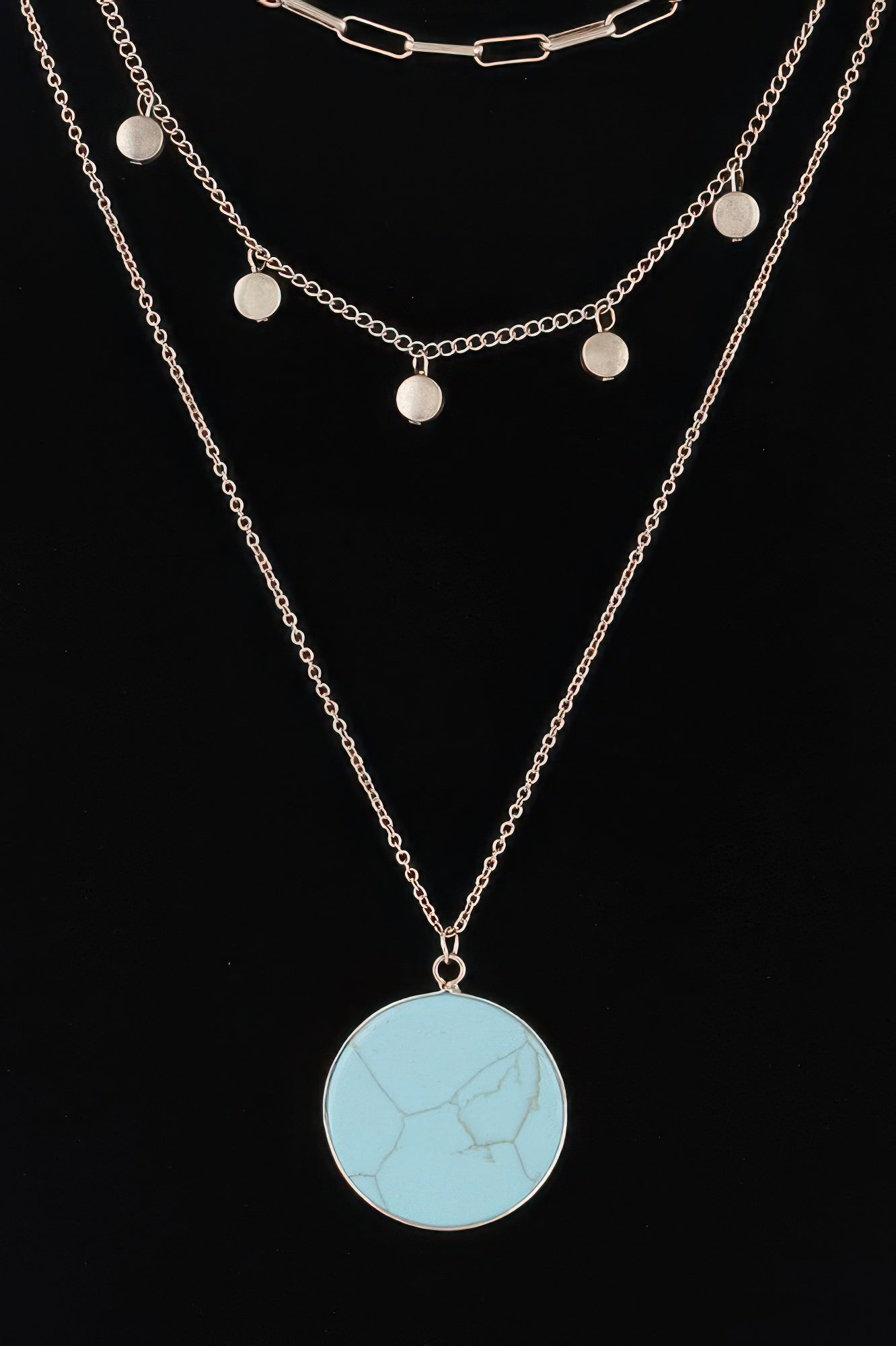 Golden Heir multi-stone pendant chain necklace featuring turquoise and gold stones on a delicate gold chain.