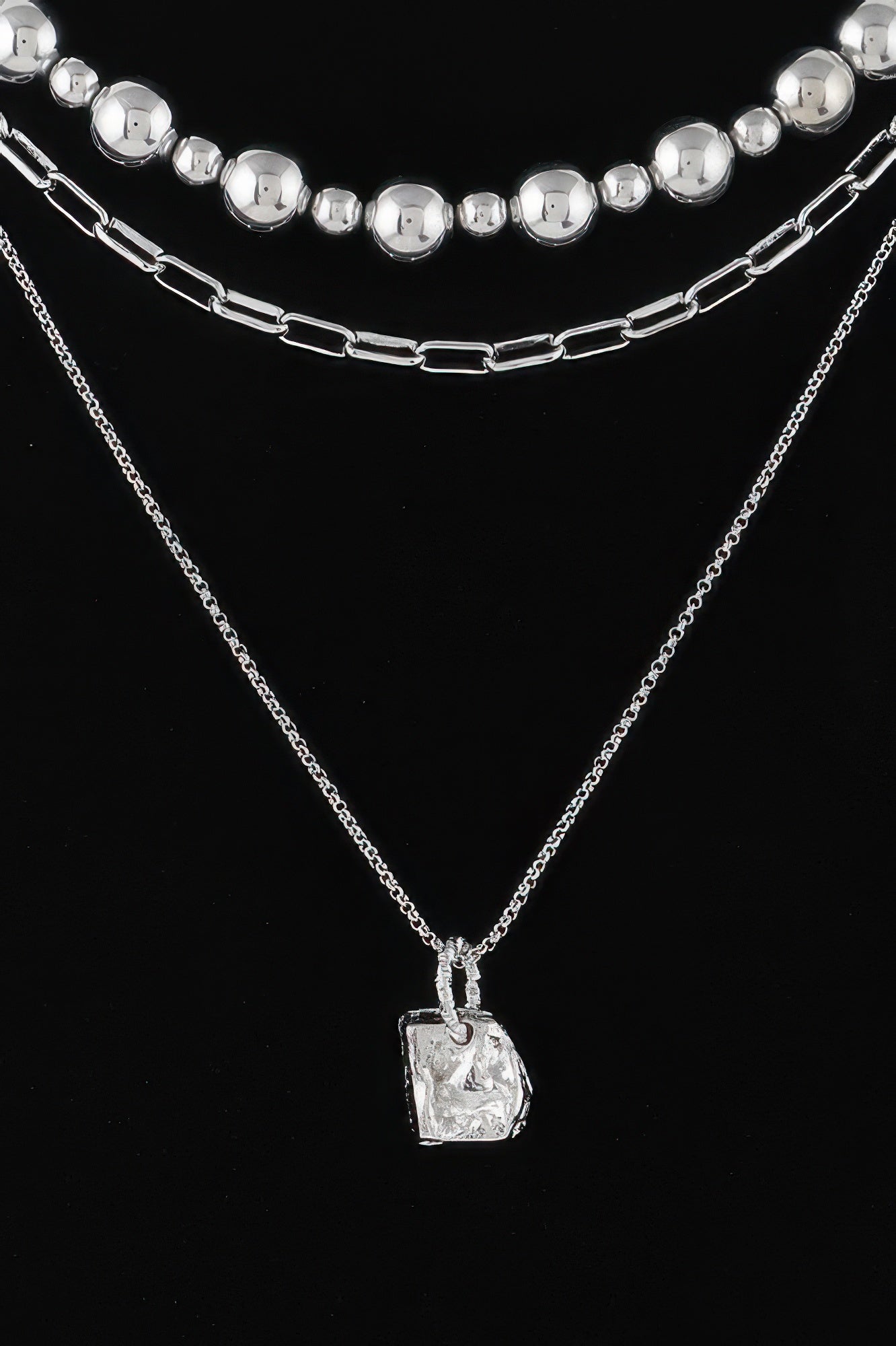 Golden Heir multi-beaded chain necklace with gold and silver beads, showcasing intricate design and stylish craftsmanship.