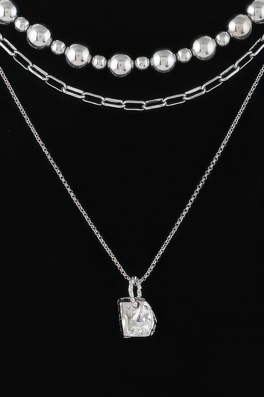 Golden Heir multi-beaded chain necklace with gold and silver beads, showcasing intricate design and stylish craftsmanship.