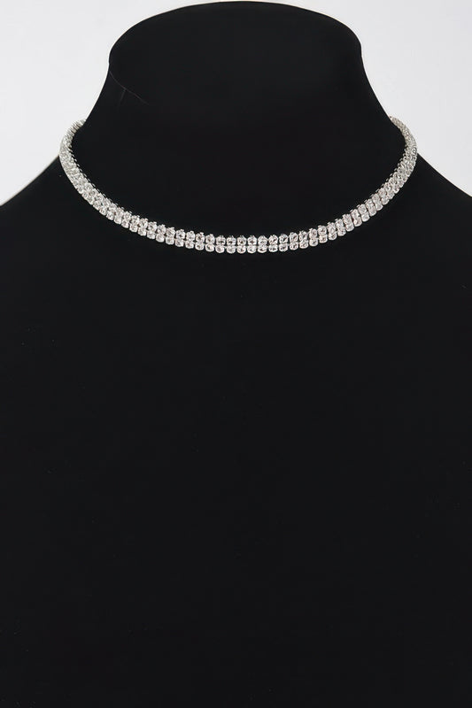 Golden Heir shiny minimal choker necklace featuring a sleek gold design, close-up view highlighting its elegant and simple style.