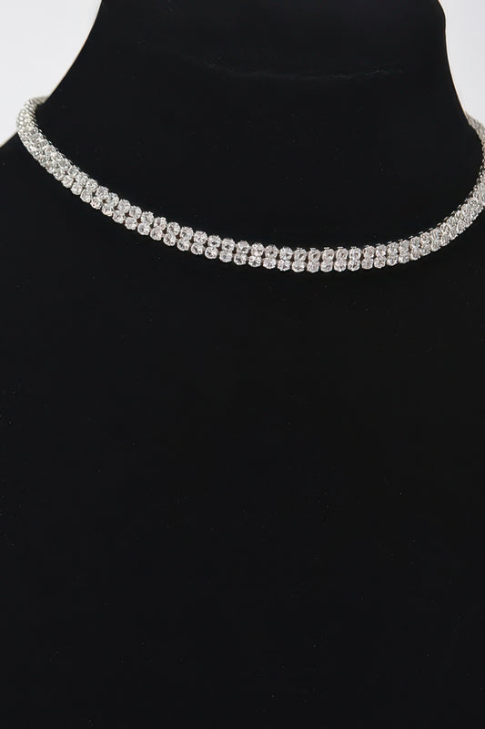 Golden Heir shiny minimal choker necklace featuring a sleek gold design, close-up view of the elegant jewelry piece.