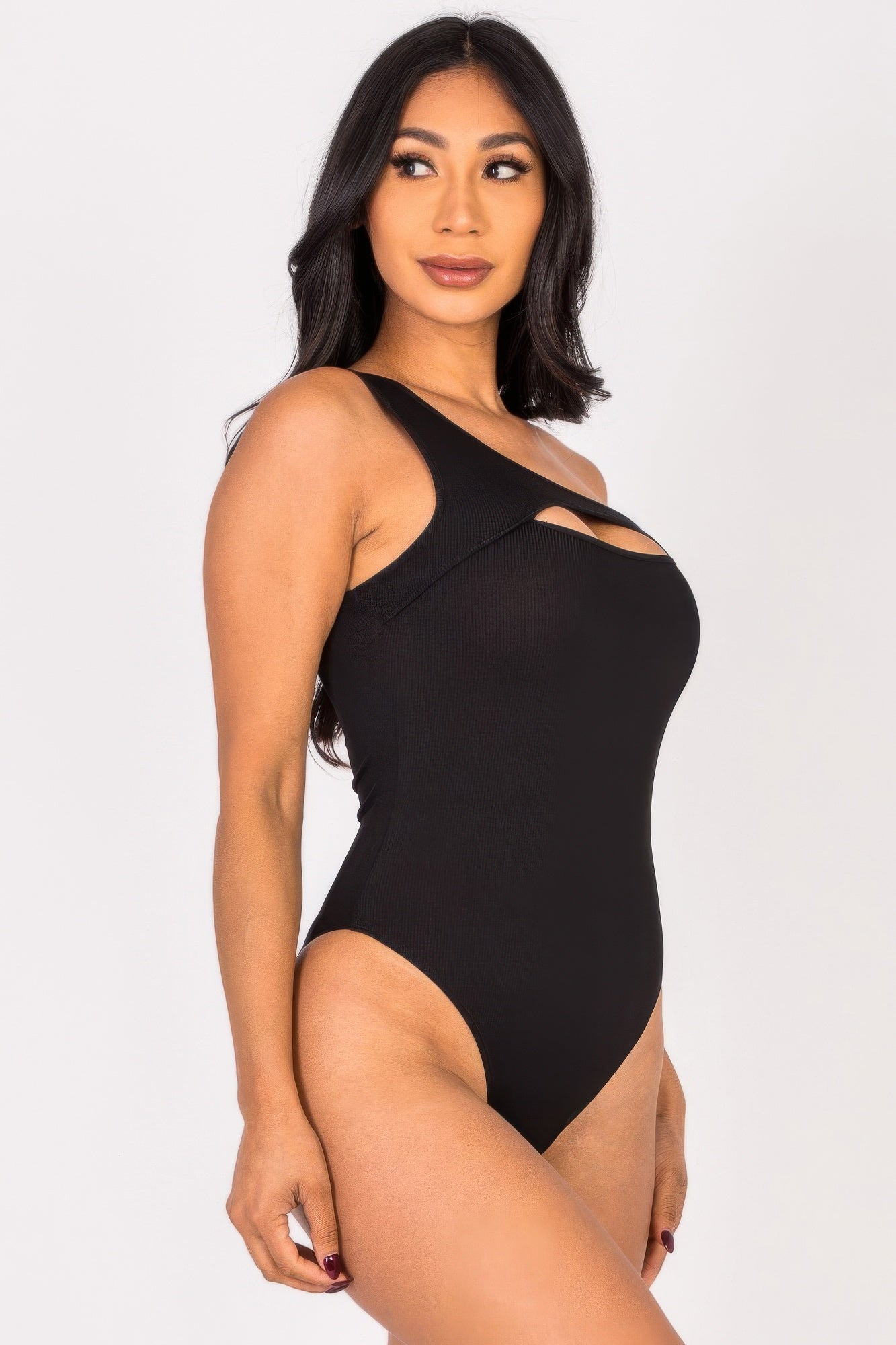 Black Golden Heir sculpted rib knit one-shoulder bodysuit, fitted design with a single shoulder strap, styled for a modern look.