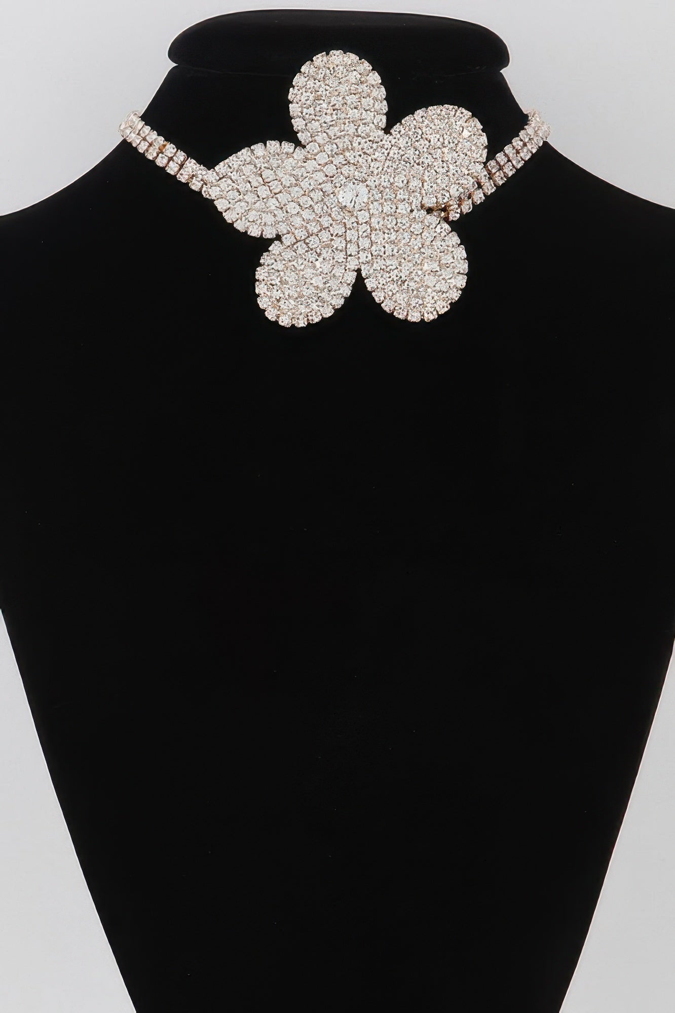 Golden Heir Flora Royale triple wrap pearl choker featuring layered pearls and a gold clasp, elegant jewelry for special occasions.