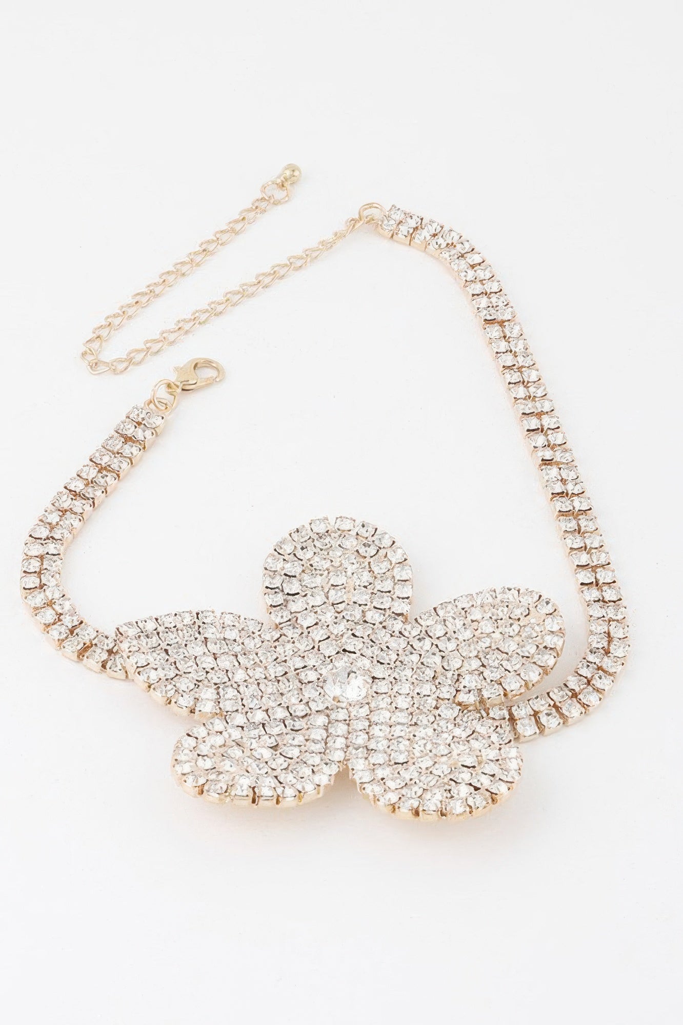 Golden Heir Flora Royale triple wrap pearl choker with clear and gold pearls, elegant jewelry accessory.
