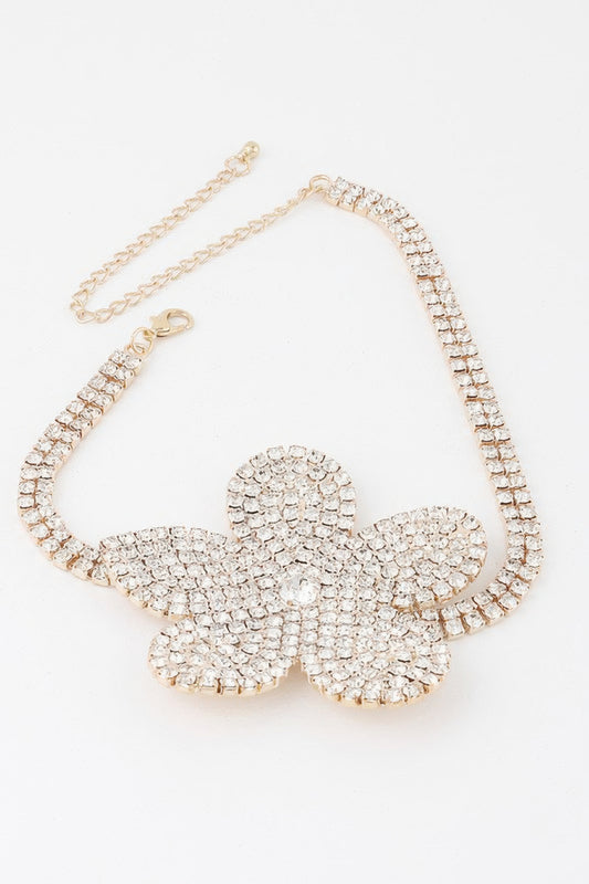 Golden Heir Flora Royale triple wrap pearl choker with clear and gold pearls, elegant jewelry accessory.