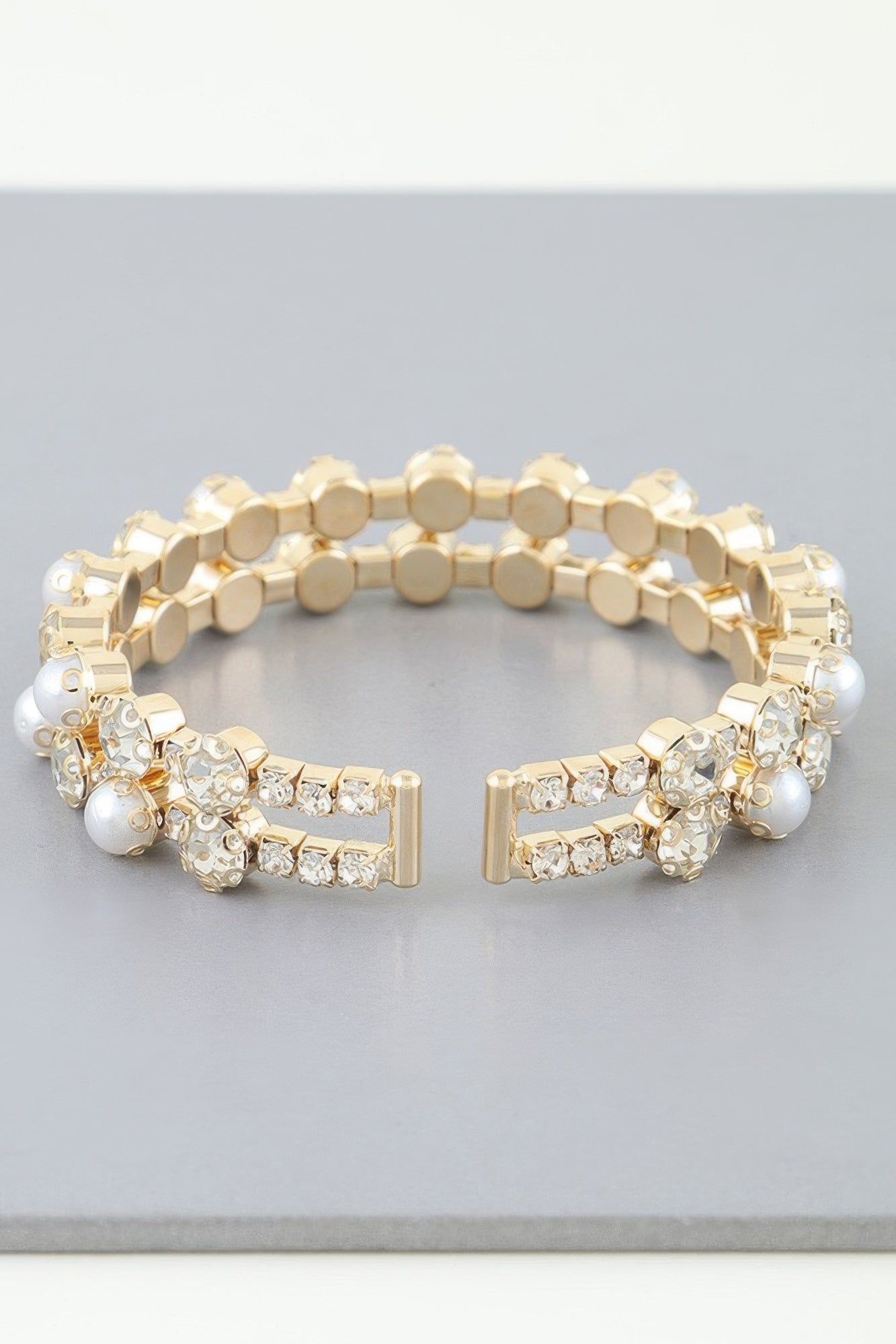 Golden Heir double pearl cuff bracelet featuring silver and golden pearls, elegant and stylish jewelry for sophisticated looks.