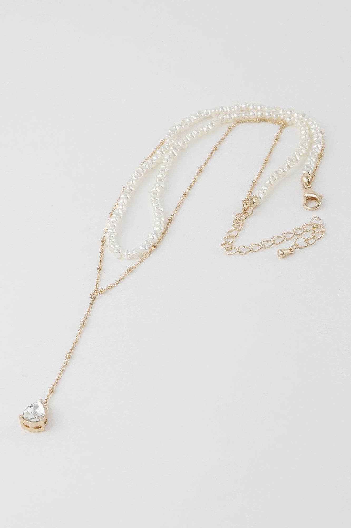 Golden Heir Aurelia double teardrop pearl necklace featuring elegant cream and gold pearls on a delicate chain.