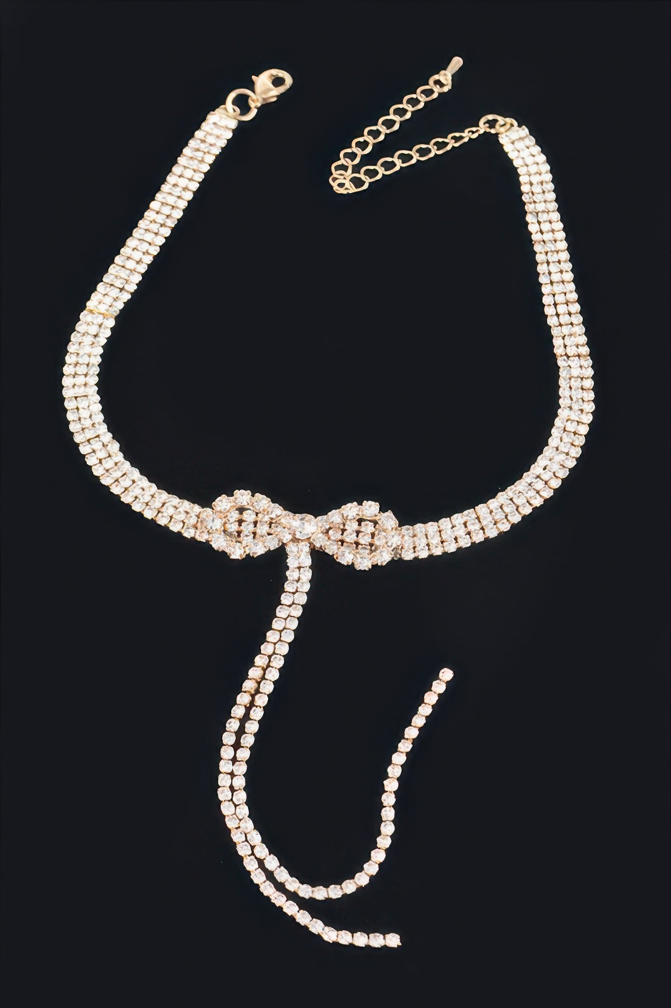 Golden Heir Elowen rhinestone bow choker with clear, gold-tone, precision-cut rhinestones, 10.5-inch statement jewelry piece.
