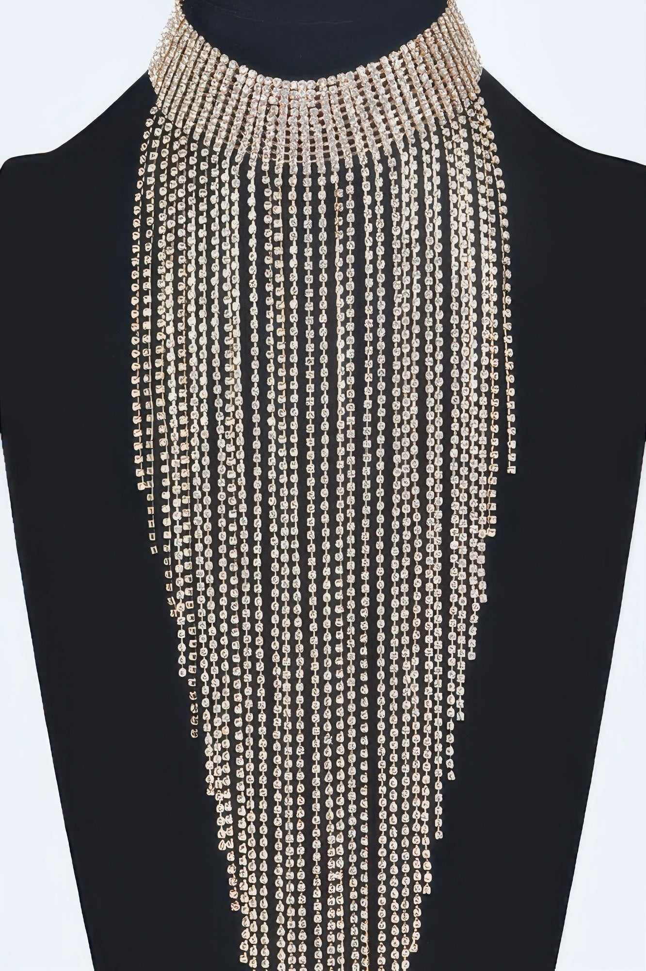 Golden Heir Astraea rhinestone tassel choker with sparkling rhinestones and gold-tone design, close-up view of elegant jewelry.