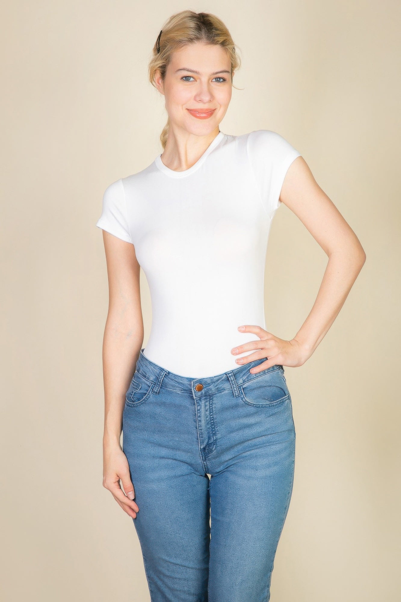 Black Golden Heir short sleeve crew neck bodysuit, form-fitting essential garment with sleek design and comfortable fit.