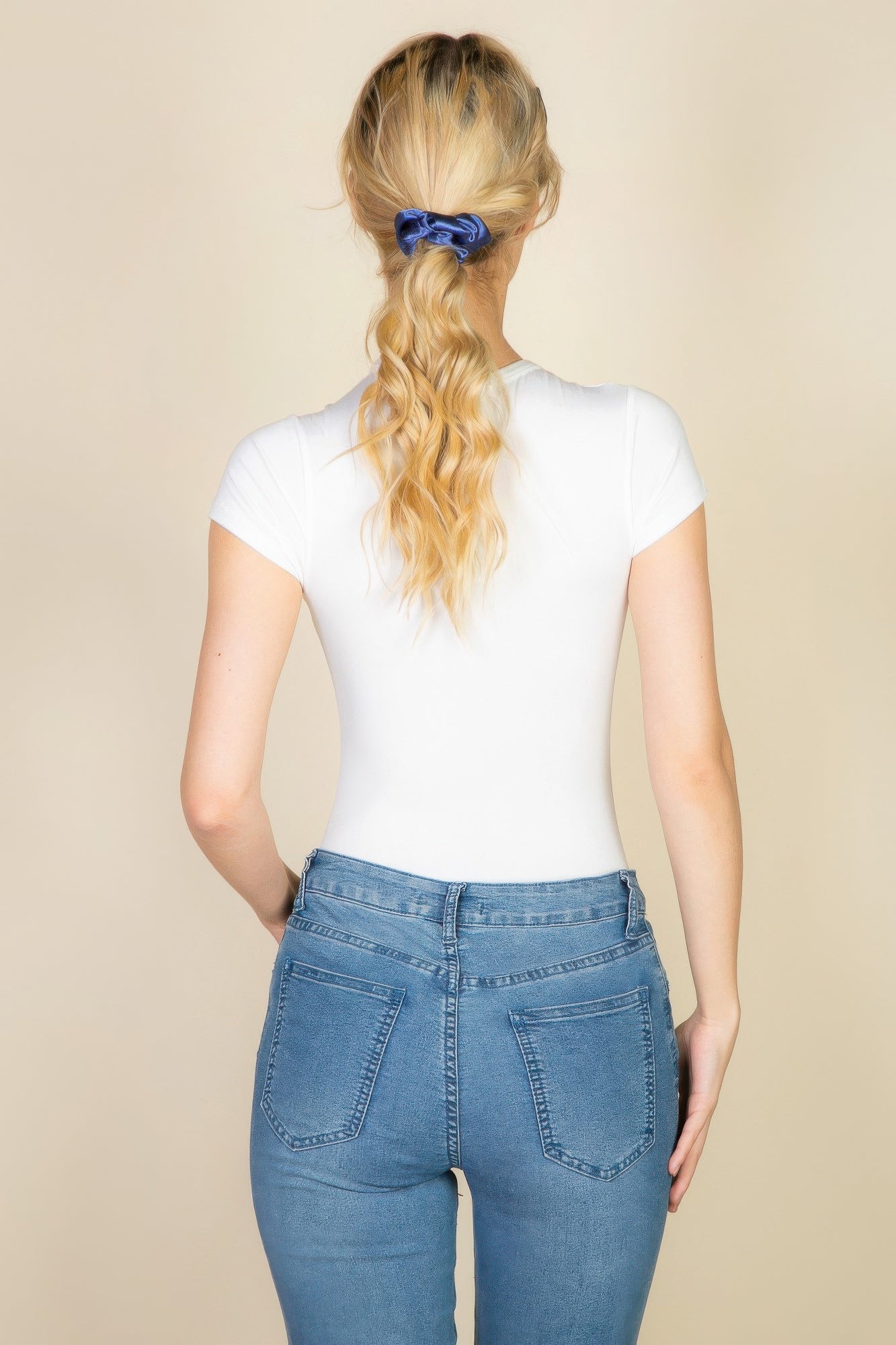 Black Golden Heir short sleeve crew neck bodysuit, form-fitting essential top with sleek fabric and minimalist design.