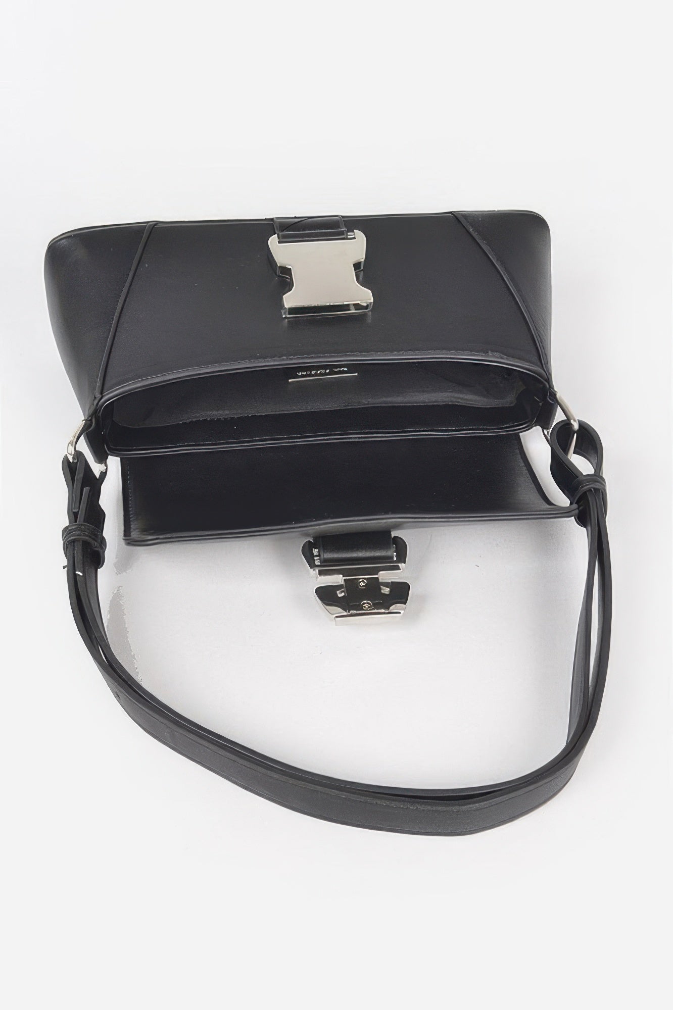 Golden Heir faux leather shoulder bag with metal buckle in black, featuring a sleek design and adjustable strap.