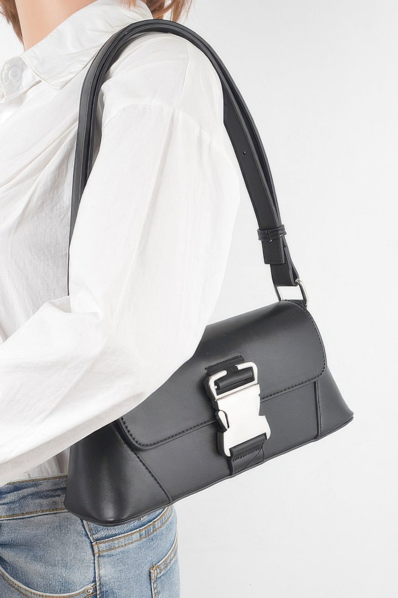 Golden Heir faux leather shoulder bag with gold-tone metal buckle and adjustable strap, black color, stylish accessory.