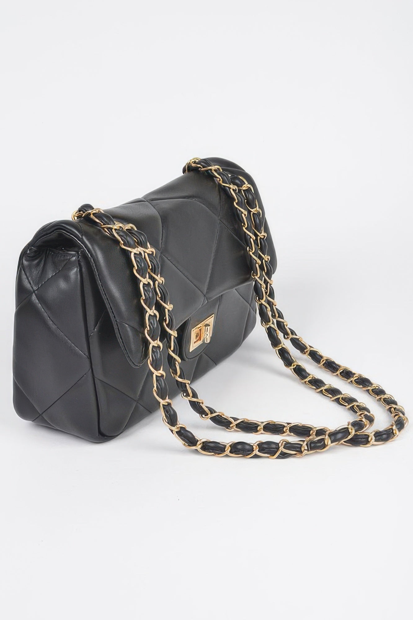 Golden Heir wide quilted shoulder bag in white with gold accents, featuring a stylish and spacious design.