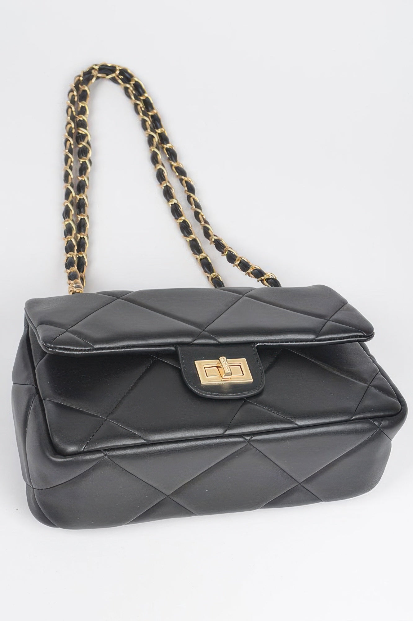 Golden Heir wide quilted shoulder bag in white, featuring a stylish design with a comfortable strap and elegant quilting details.
