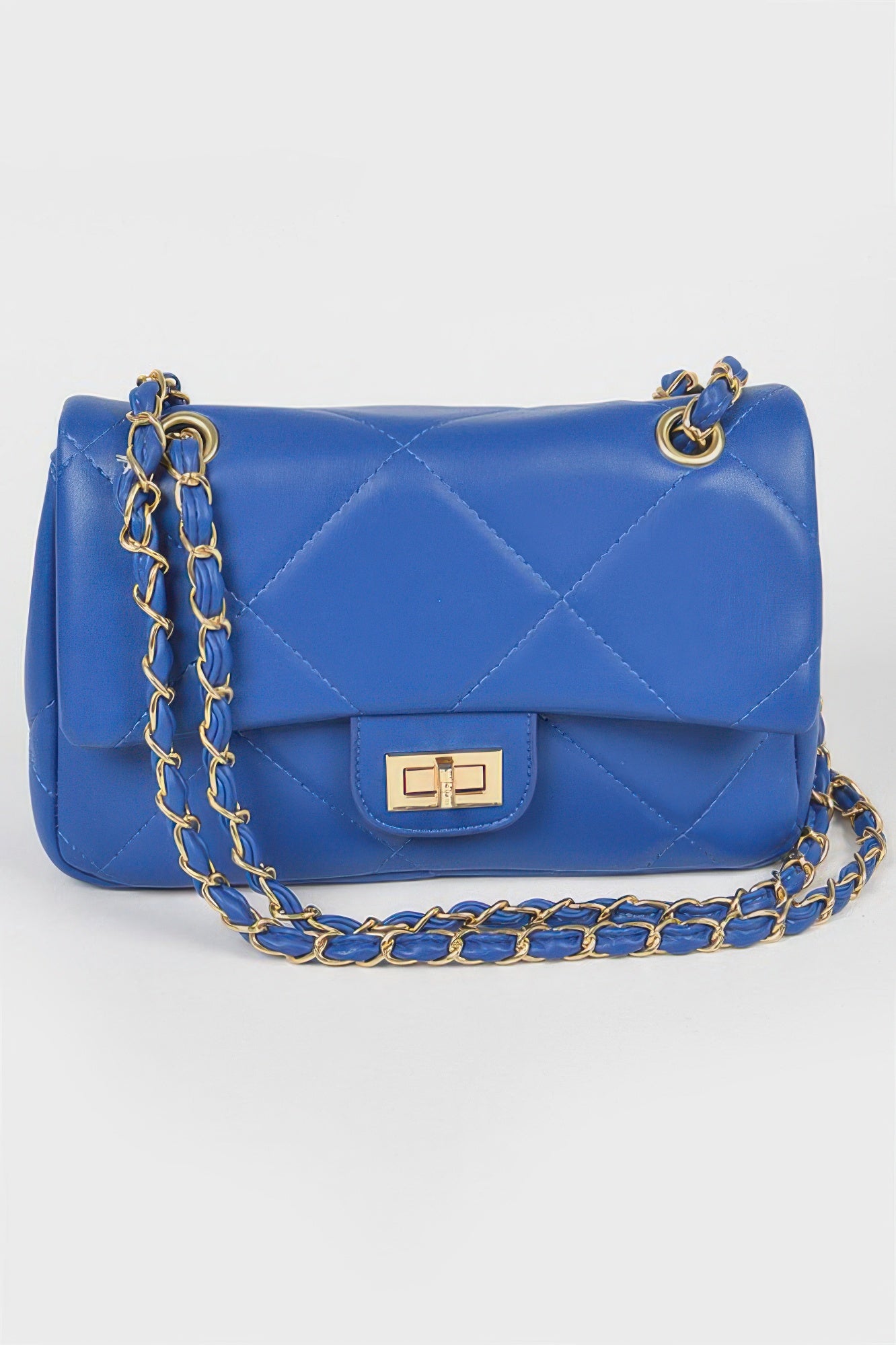Golden Heir wide quilted shoulder bag in white with gold accents, featuring a stylish, spacious design for everyday use.