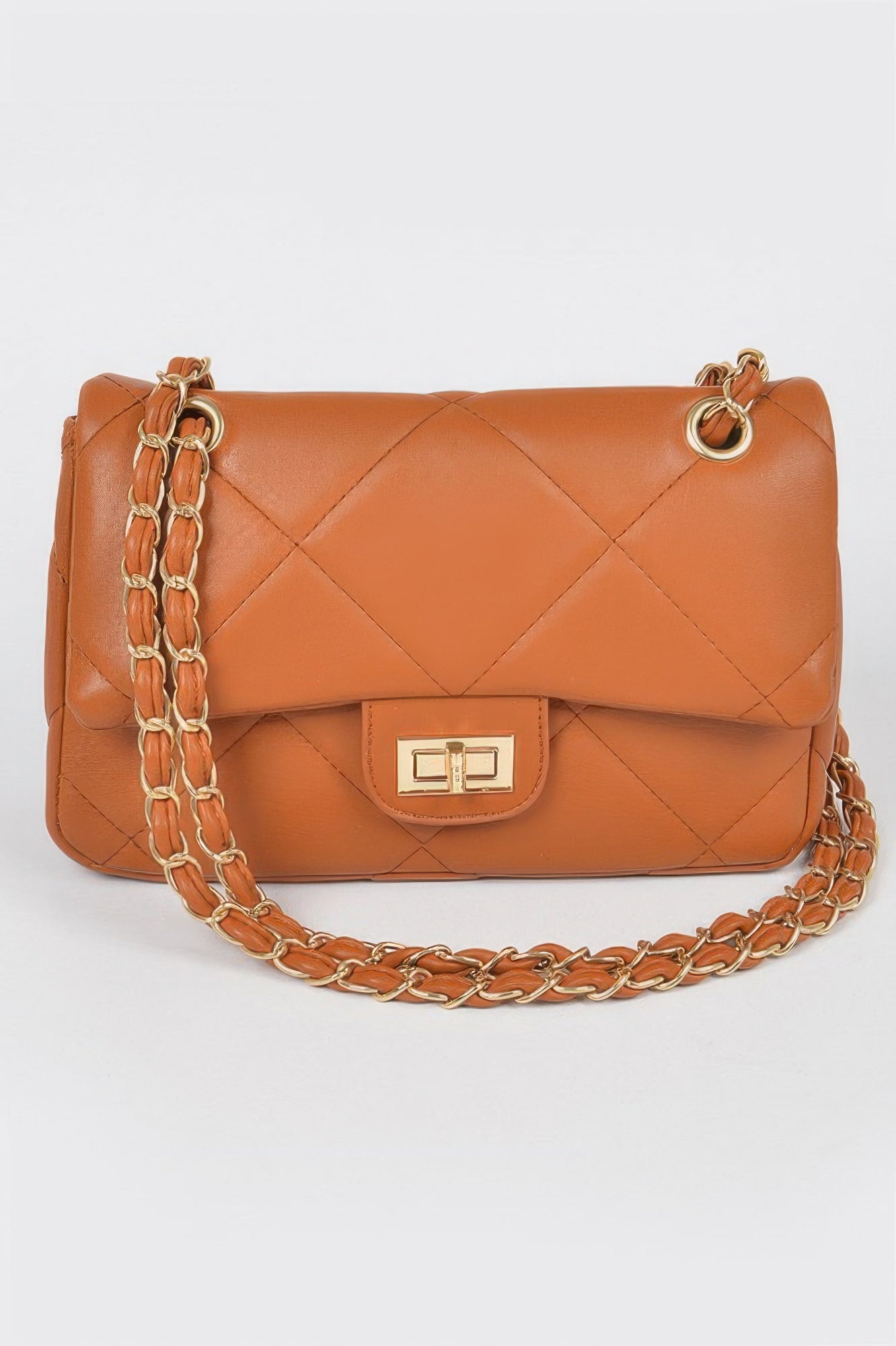 Golden Heir wide quilted shoulder bag in white with gold accents, showcasing a stylish and spacious design.