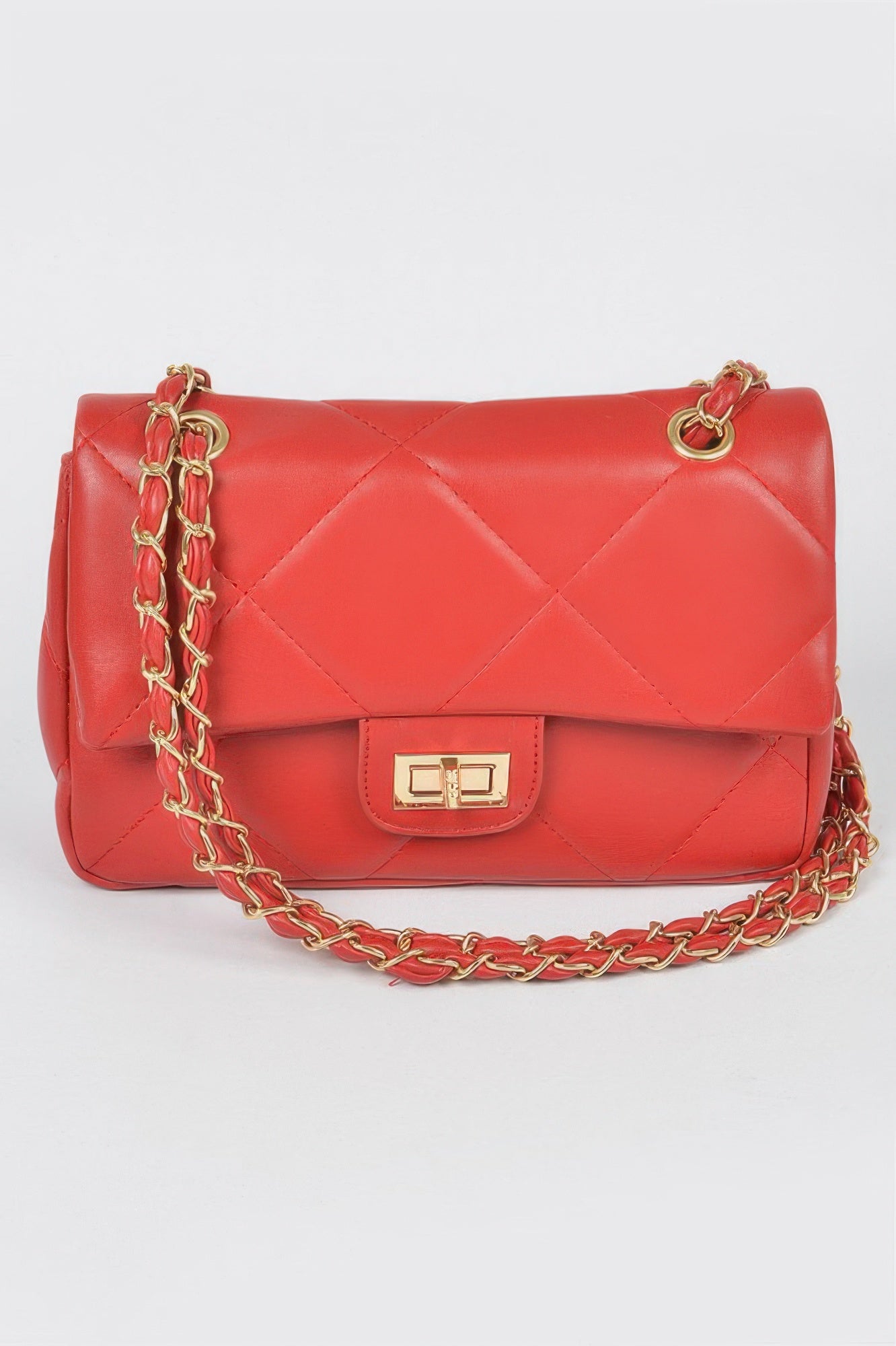 Golden Heir wide quilted shoulder bag in white with gold accents, featuring a stylish, spacious design and padded shoulder strap.