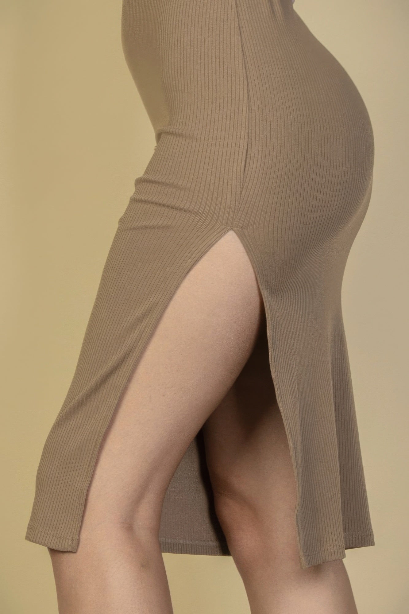Black Golden Heir ribbed sleeveless tank midi dress displayed hanging, showcasing its sleek fitted silhouette and elegant design.