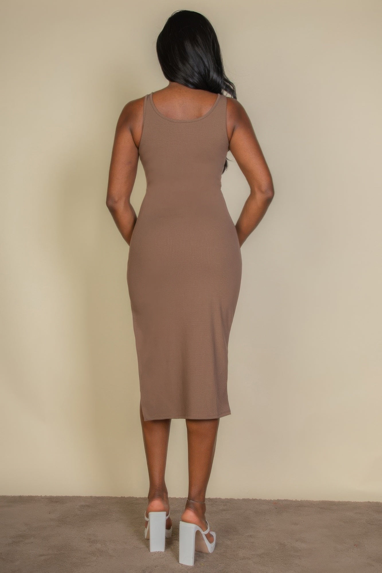 Black Golden Heir sleeveless ribbed midi tank dress displayed on a hanger, showcasing its fitted silhouette and midi length.