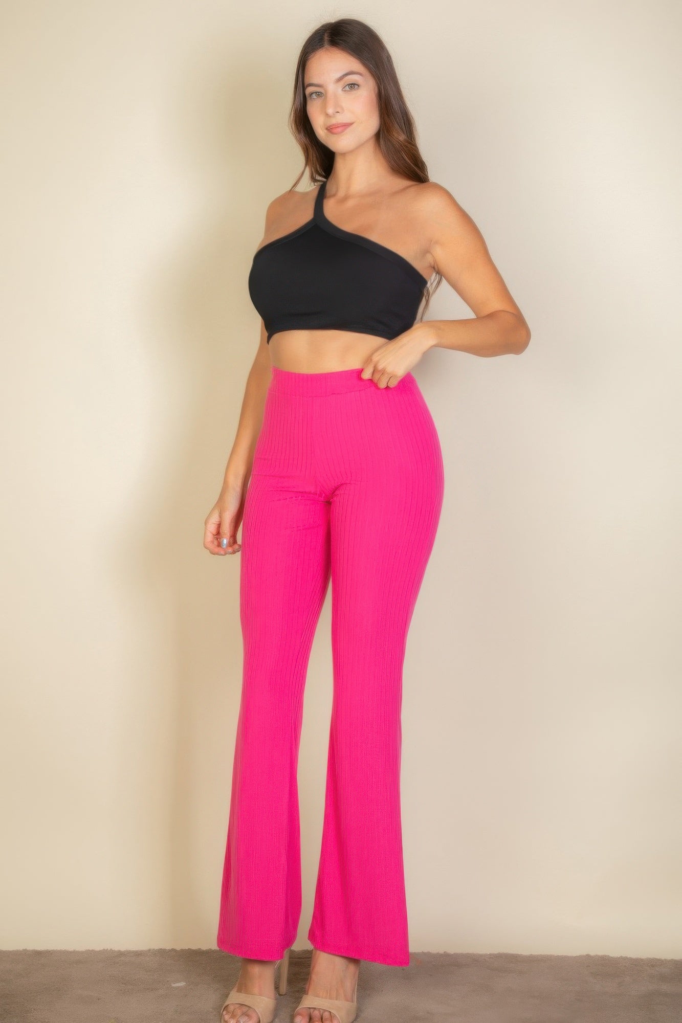 Black Golden Heir one-shoulder ribbed cropped tank top displayed on a flat surface.