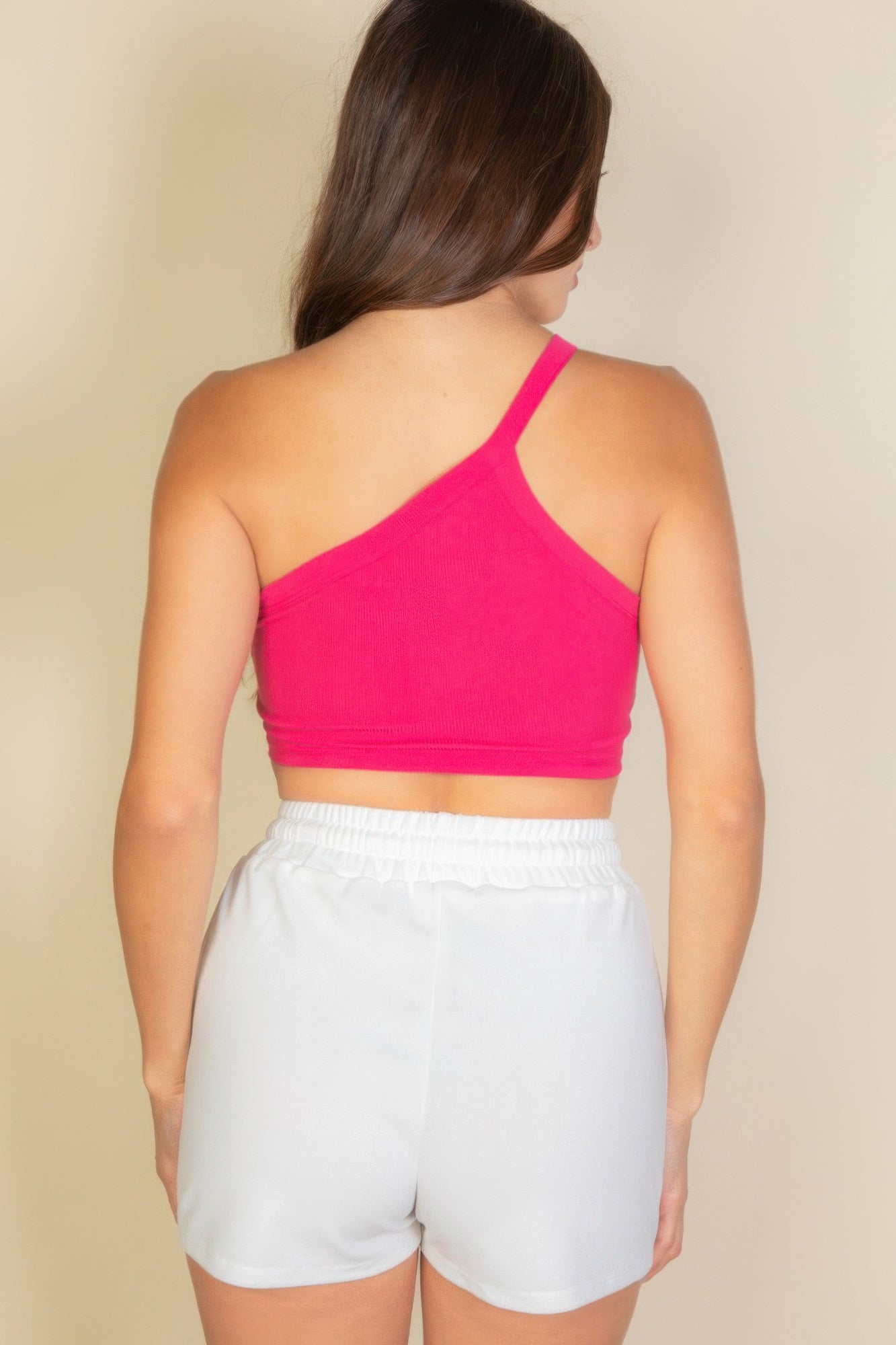Black Golden Heir one-shoulder ribbed cropped tank top displayed on a flat lay.