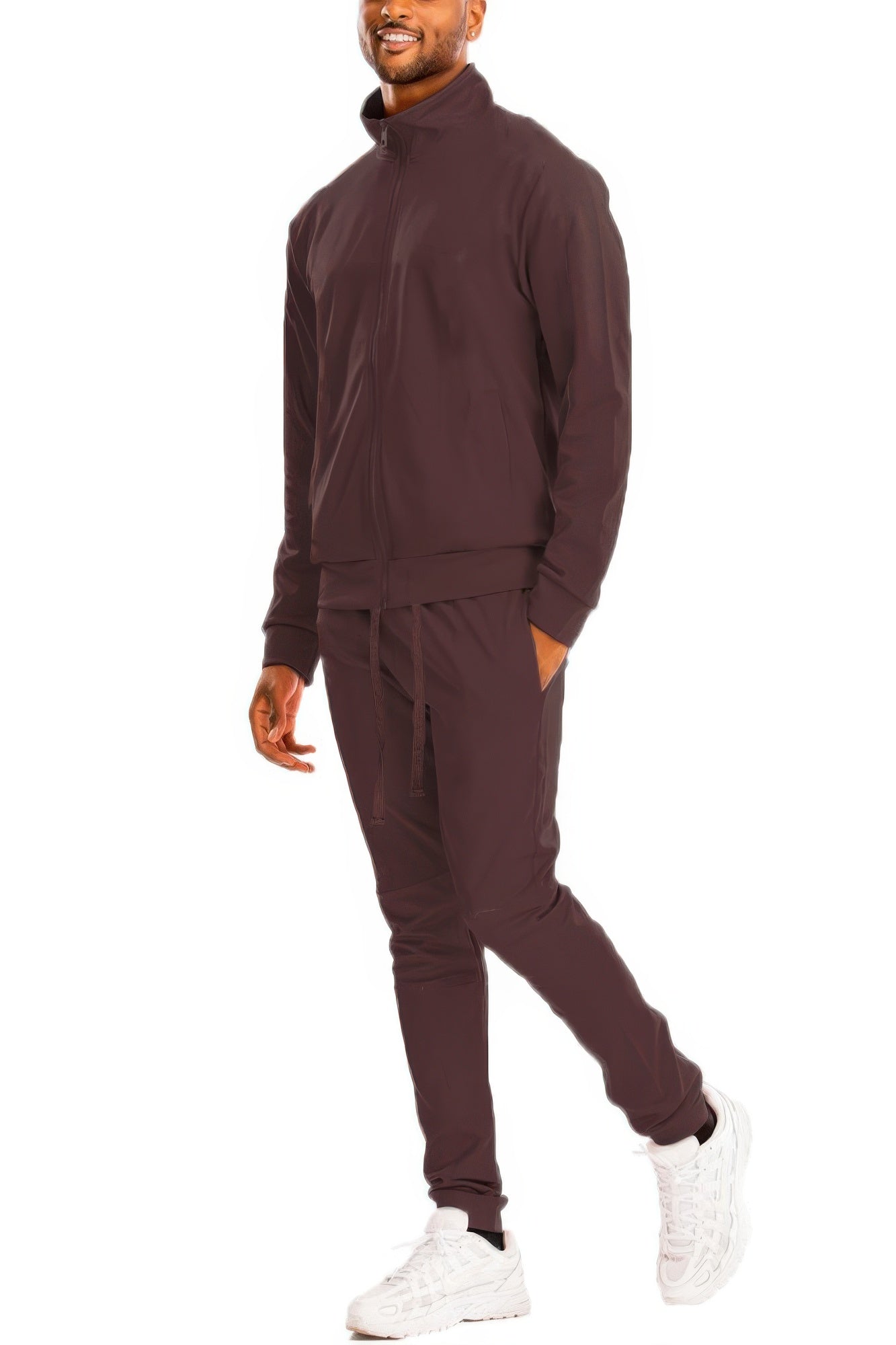 Black Golden Heir full zip-up track jacket with a solid design and golden accents, shown on a model.