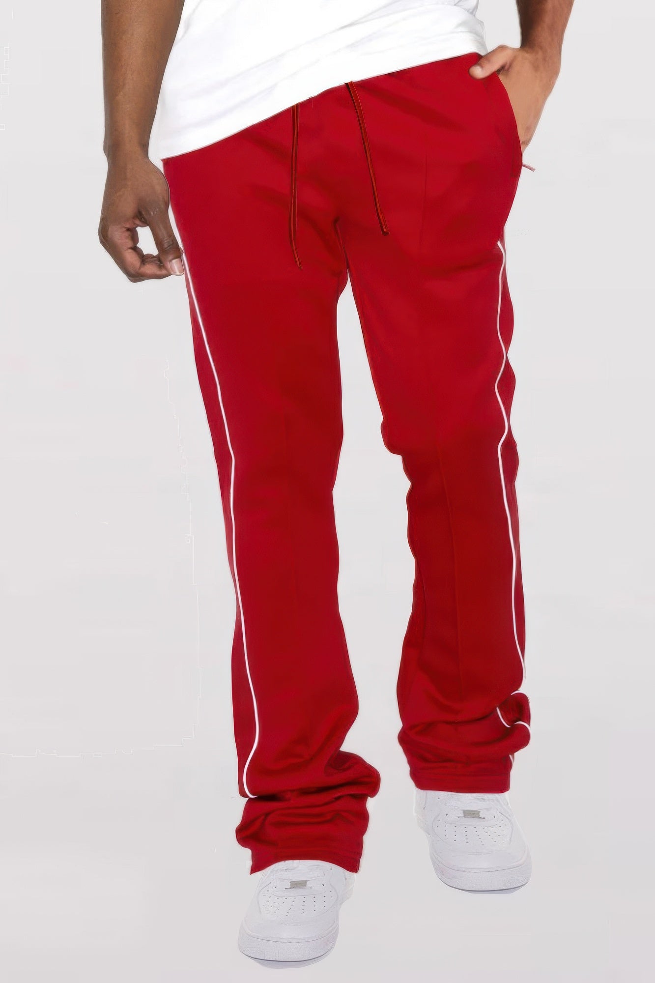 Golden Heir men's black side pipe stacked flare track pants with a relaxed fit and stylish design, shown on a model.