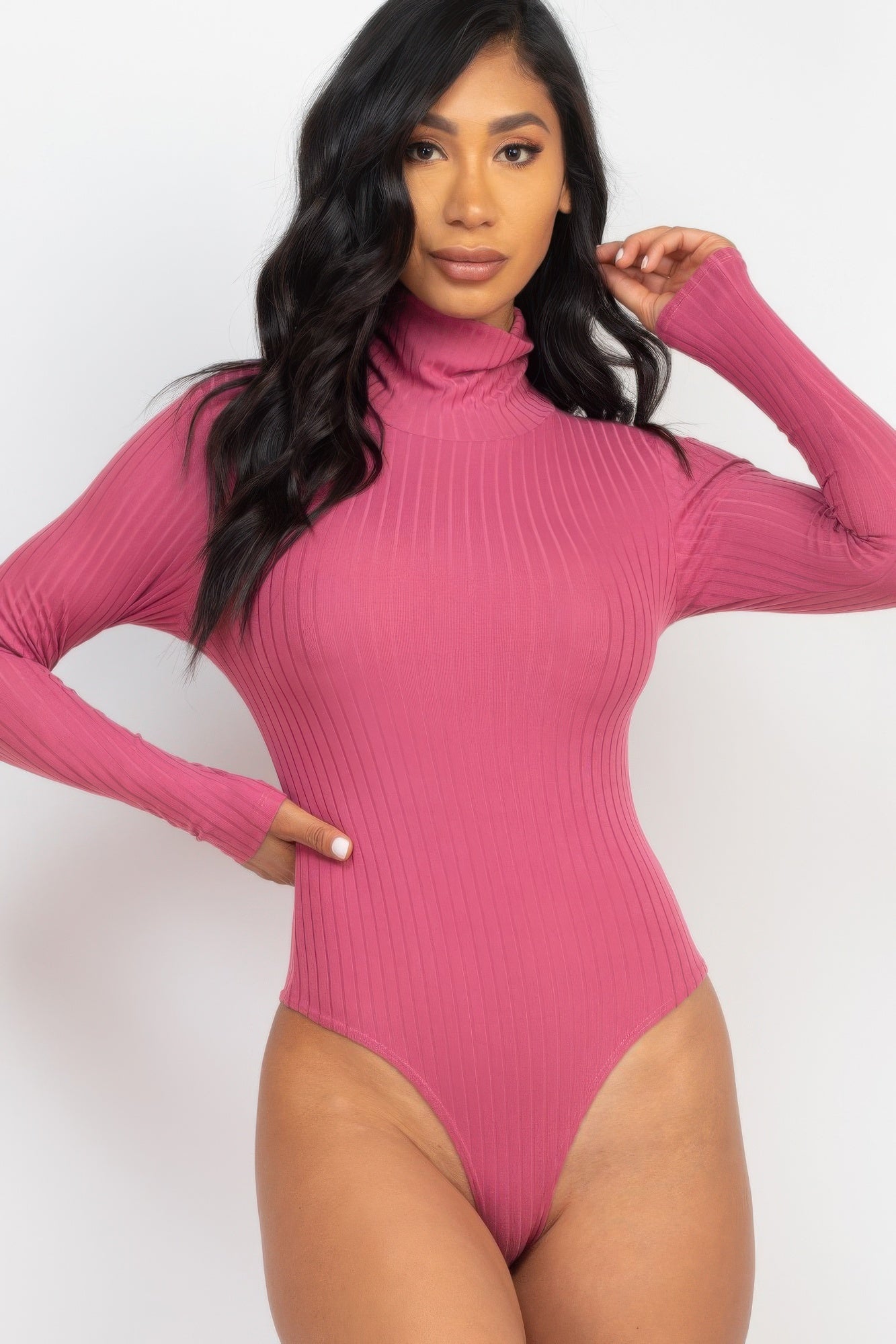 Black Golden Heir sculpted ribbed turtleneck long sleeve bodysuit displayed on a model, showcasing its fitted design and ribbed texture.