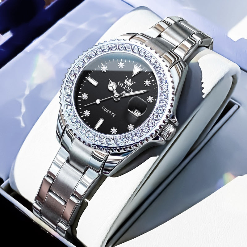 Green leather strap Golden Heir women's stylish business quartz watch on a green book, showcasing elegant design and watch face.