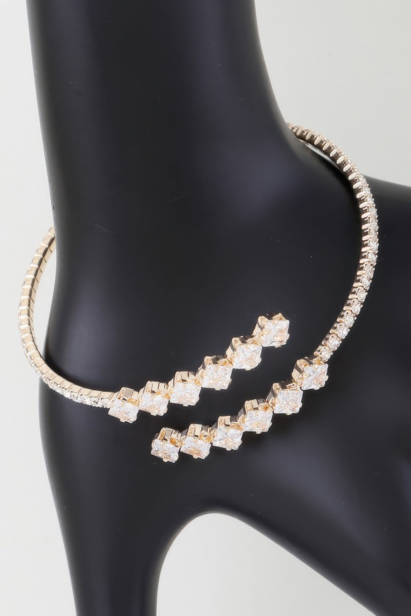 Golden Heir jeweled shiny star wrap bracelet featuring gold-tone and clear accents, designed for a stylish and elegant look.