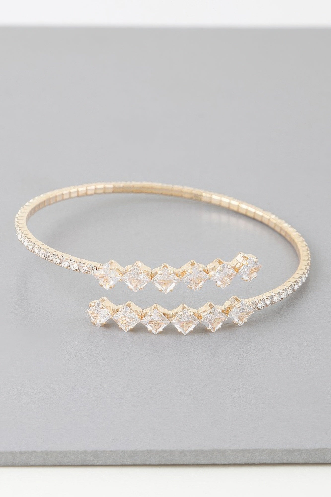 Golden Heir jeweled shiny star wrap bracelet with silver and gold accents, featuring sparkling embellishments and a stylish wrap design.