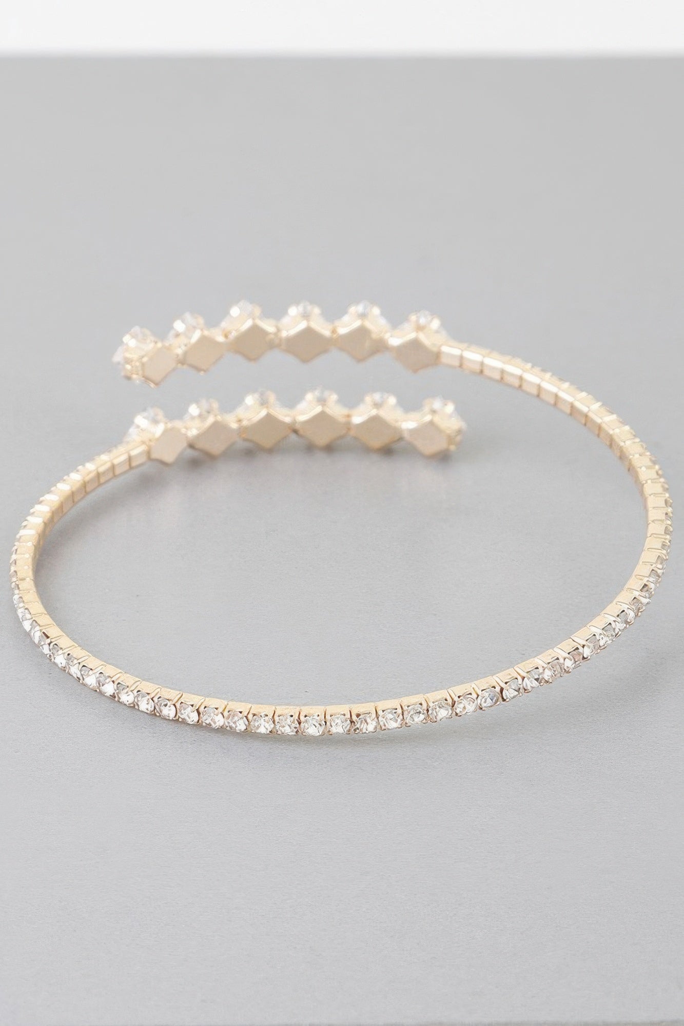 Golden Heir jeweled shiny star wrap bracelet with golden and silver accents, featuring sparkling embellishments and a stylish design.
